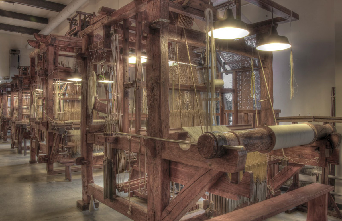 It was in the 16th century that the first mechanical looms were developed, driven by a water-powered system